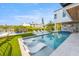 Stunning pool and patio area with waterfront views and lounge chairs at 111 Gull Dr, Anna Maria, FL 34216