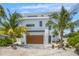 Modern two-story home with attached garage at 111 Gull Dr, Anna Maria, FL 34216