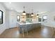 Spacious kitchen with gray cabinetry, quartz countertops, and a large island at 111 Gull Dr, Anna Maria, FL 34216