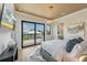 Bright bedroom with water views and a large TV at 111 Gull Dr, Anna Maria, FL 34216