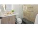 Stylish bathroom with a glass shower, marble accents, and gold hardware at 111 Gull Dr, Anna Maria, FL 34216