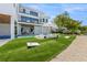 Large backyard with artificial turf, pool, and lounge area at 111 Gull Dr, Anna Maria, FL 34216