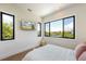 Bright bedroom with water views and a comfortable bed at 111 Gull Dr, Anna Maria, FL 34216