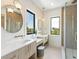 Elegant bathroom with double vanity, large mirrors, and walk-in shower at 111 Gull Dr, Anna Maria, FL 34216