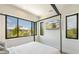Spacious bedroom with a large TV and beach views at 111 Gull Dr, Anna Maria, FL 34216