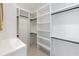 Spacious walk-in closet with ample shelving and hanging space at 111 Gull Dr, Anna Maria, FL 34216