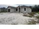 Newly constructed home with a block exterior and a spacious yard at 8233 Givlic Ln, North Port, FL 34287