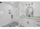 Modern bathroom featuring a glass-enclosed shower, marble countertops, and updated fixtures at 280 Hidden Bay Dr # 203, Osprey, FL 34229
