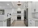 Bright kitchen with stainless steel appliances, a kitchen island, and recessed lighting at 280 Hidden Bay Dr # 203, Osprey, FL 34229