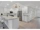 Modern kitchen with white cabinetry, stainless steel appliances, and stone countertops at 280 Hidden Bay Dr # 203, Osprey, FL 34229