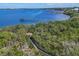 Aerial view of a walkway, surrounding greenery, and body of water at 280 Hidden Bay Dr # 204, Osprey, FL 34229