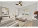 Twin beds in a bedroom with wood floors and a bright window allowing natural light at 280 Hidden Bay Dr # 204, Osprey, FL 34229