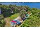 Kayaks on a rack surrounded by lush tropical vegetation at 280 Hidden Bay Dr # 204, Osprey, FL 34229