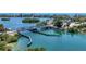Aerial view of the bridge crossing over the blue waters, with lush vegetation and clear skies at 280 Hidden Bay Dr # 302, Osprey, FL 34229