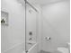 Clean bathroom featuring a glass shower, bathtub, and a neutral color palette at 280 Hidden Bay Dr # 302, Osprey, FL 34229