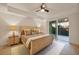 Beautiful bedroom featuring a ceiling fan, balcony access, and stylish decor at 280 Hidden Bay Dr # 302, Osprey, FL 34229