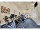 Well-equipped gym with modern exercise equipment, ceiling fan, and large windows at 280 Hidden Bay Dr # 302, Osprey, FL 34229