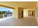 Open-air condo hallway featuring an elevator and balcony views with natural light and tiled floors at 280 Hidden Bay Dr # 302, Osprey, FL 34229