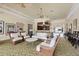 Bright lounge with wicker furniture, ceiling fans, and views of the building at 280 Hidden Bay Dr # 302, Osprey, FL 34229