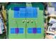 Aerial view of well-maintained tennis and pickleball courts with comfortable seating areas at 280 Hidden Bay Dr # 302, Osprey, FL 34229