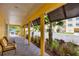 Covered walkway with brick floor, providing shade and protection from the elements at 280 Hidden Bay Dr # 302, Osprey, FL 34229