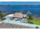 Charming waterfront restaurant with outdoor seating and docks for boat access at 280 Hidden Bay Dr # 302, Osprey, FL 34229