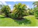 Lush landscaping in a well-maintained yard, offering a serene outdoor environment at 9613 Turning Leaf Ter, Bradenton, FL 34212