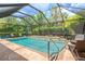 Screened pool and patio area with lounge chairs at 9613 Turning Leaf Ter, Bradenton, FL 34212