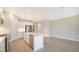 Open concept kitchen with island and stainless steel appliances at 100 Corserra Dr, Nokomis, FL 34275