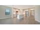 Modern kitchen with white cabinets, stainless steel appliances, and quartz countertops at 100 Corserra Dr, Nokomis, FL 34275