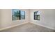 Bright room with large windows and wood-look flooring at 100 Corserra Dr, Nokomis, FL 34275