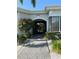 Attractive building entrance with landscaping and paved walkway at 2333 Feather Sound Dr # B407, Clearwater, FL 33762
