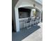 Community BBQ area with seating for grilling and entertaining at 2333 Feather Sound Dr # B407, Clearwater, FL 33762
