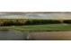 Peaceful landscape featuring a golf course and lake at 2333 Feather Sound Dr # B407, Clearwater, FL 33762