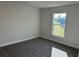 Comfortable bedroom with a large window offering nice neighborhood view at 2600 Averland Loop, North Port, FL 34287
