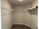 Walk-in closet with carpet, shelving, and plenty of storage space at 2600 Averland Loop, North Port, FL 34287