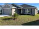 Charming single-story home featuring a well-maintained lawn and attached two-car garage at 2600 Averland Loop, North Port, FL 34287