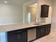 Granite countertops, stainless steel dishwasher and sink complete this stylish kitchen at 2600 Averland Loop, North Port, FL 34287