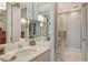 Elegant bathroom with a quartz vanity and glass-enclosed shower at 6285 Midnight Pass Rd # 309, Sarasota, FL 34242