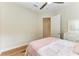 Cozy bedroom with light wood floors and pink accents at 3763 Eagle Hammock Dr, Sarasota, FL 34240