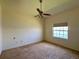 Bright bedroom with a ceiling fan and a view at 1457 San Cristobal Ave # 3203, Punta Gorda, FL 33983