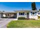Quaint single story home with blue shutters and carport at 6029 Lilli Way # 6029, Bradenton, FL 34207