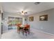 Dining room featuring a table, chairs, and sliding glass doors at 2119 Pellam Blvd, Port Charlotte, FL 33948