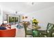 Open concept living and dining area with coastal decor and a view to the balcony at 5641 Midnight Pass Rd # 902, Sarasota, FL 34242