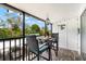 Charming balcony with bistro set, offering scenic views at 5641 Midnight Pass Rd # 902, Sarasota, FL 34242