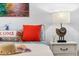 Cozy bedroom with nautical decor and comfortable bedding at 5641 Midnight Pass Rd # 902, Sarasota, FL 34242