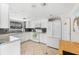 Bright kitchen with white cabinets and granite counters at 5641 Midnight Pass Rd # 902, Sarasota, FL 34242