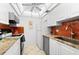 Clean and bright kitchen with granite countertops and stainless steel appliances at 5641 Midnight Pass Rd # 902, Sarasota, FL 34242