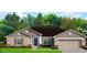 Charming single-story home with a two-car garage, a well-manicured lawn, and beautiful landscaping at 2679 Englewood Rd, Venice, FL 34293