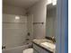 Bathroom with shower/tub combo, granite counters, and updated fixtures at 855 Cumberland Rd, Venice, FL 34293